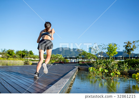 Woman running in outdoor park Woman running in outdoor park 32861215