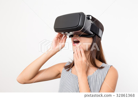 Woman looking with VR device and feeling excite Woman looking with VR device and feeling excite 32861368