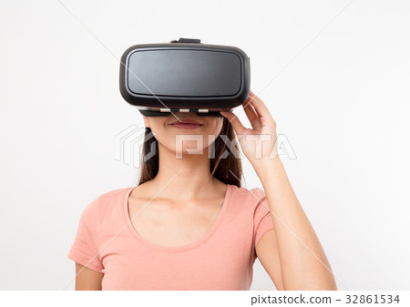 Young asian woman use of virtual reality device Young asian woman use of virtual reality device 32861534