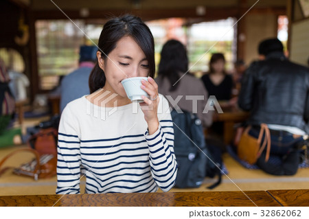 Woman drink of tea in Japanese restaurant 32862062