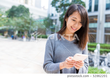 Business woman use of mobile phone Business woman use of mobile phone 32862201