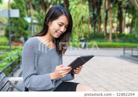 Woman use of tablet computer Woman use of tablet computer 32862204