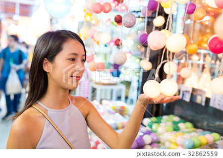 Woman choosing lantern in street market in bangkok city Woman choosing lantern in street market in bangkok city 32862559