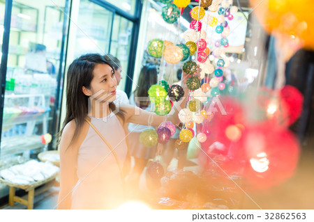 Woman shopping at decoration lantern in street market 32862563
