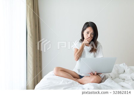 Woman feeling scary on laptop computer 32862814