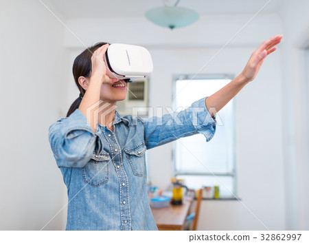 Woman watching with virtual reality device Woman watching with virtual reality device 32862997