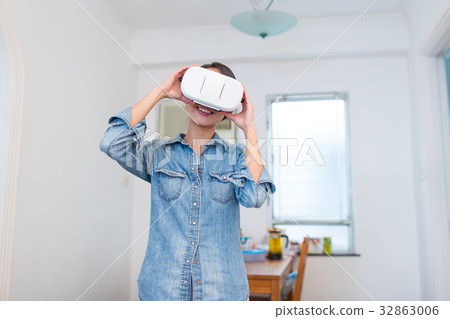 Woman wearing VR device Woman wearing VR device 32863006