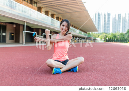 Sport woman doing warm up exercise in sport stadium Sport woman doing warm up exercise in sport stadium 32863038