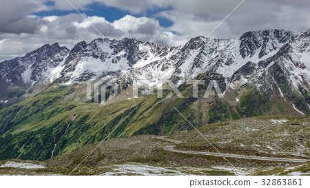 Gavia pass view in july with snowed mountains Gavia pass view in july with snowed mountains 32863861