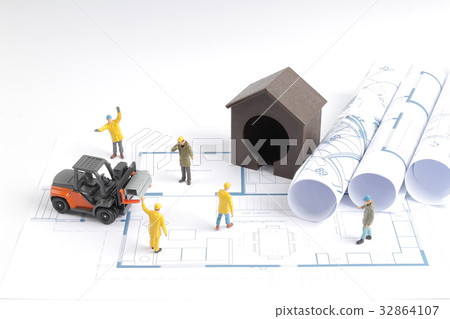 building house on blueprints with worker building house on blueprints with worker 32864107