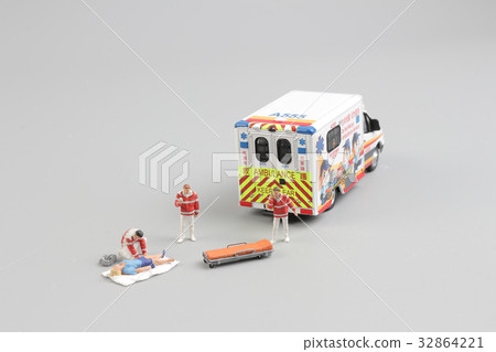 paramedics transport a patient to ambulance car 32864221