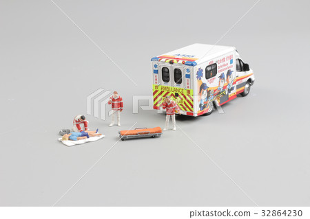 paramedics transport a patient to ambulance car 32864230