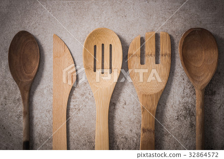 Vintage wooden kitchen utensils, flat lay on stone 32864572