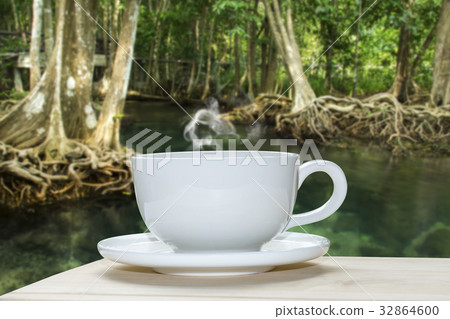White coffee cup with blur background. White coffee cup with blur background. 32864600