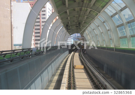 Monorail passing though the tunnel Monorail passing though the tunnel 32865368