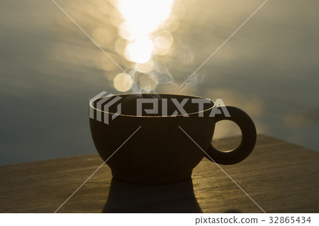 Wood cup coffee with sunlight. 32865434
