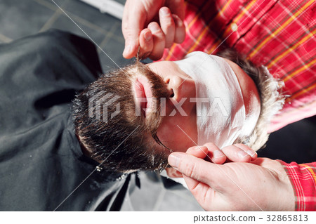 Hipster guy getting his mustache ready for twist 32865813
