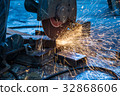 worker in constructing industry grinding metal 32868606