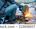 worker in constructing industry grinding metal 32868607