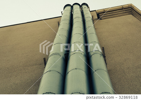 The pipes on the outside wall of the building The pipes on the outside wall of the building 32869118