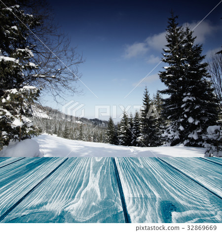 Wooden planks with a winter landscape 32869669