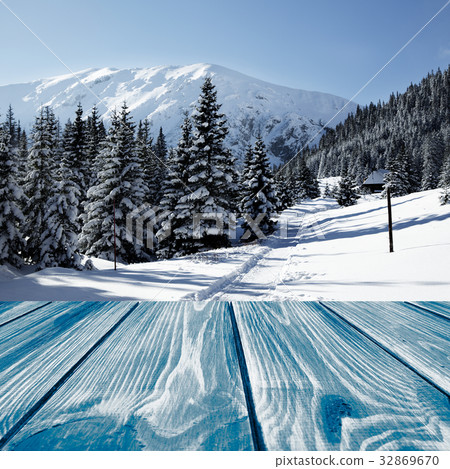 Wooden planks with a winter landscape 32869670