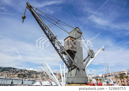 A crane on the floating dock in the harbor .Plenty A crane on the floating dock in the harbor .Plenty 32869755