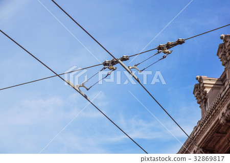 Streetcars or tram electric wires close up. Streetcars or tram electric wires close up. 32869817