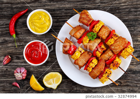 hot Grilled pork meat with corn cob slices 32874994
