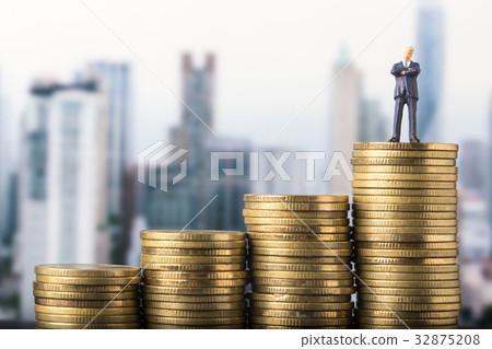 miniature model investment standing on coin miniature model investment standing on coin 32875208