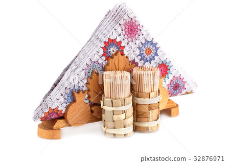 Paper napkins in holder and toothpicks 32876971