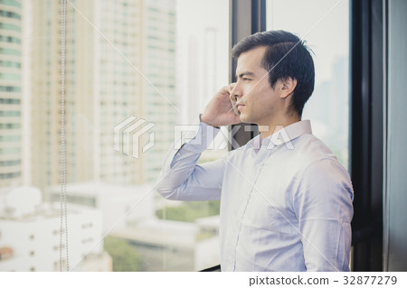 Businessman using smartphone Businessman using smartphone 32877279