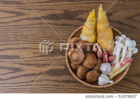 a basket of vegetables and wood tabletop a basket of vegetables and wood tabletop 32879607