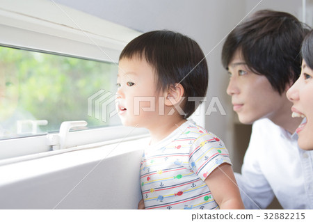 Family looking out the window 32882215