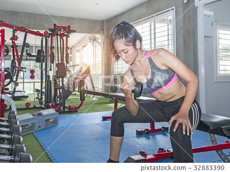 exercising with dumbbells exercising with dumbbells 32883390