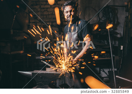 man using angle grinder sparks 32885849