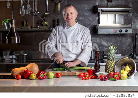 chef cutting with knife preparation preparing 32885854