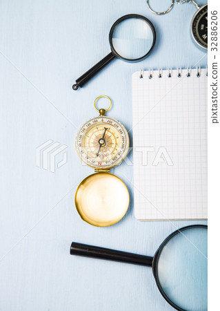 Compass, magnifying glass and notebook Compass, magnifying glass and notebook 32886206