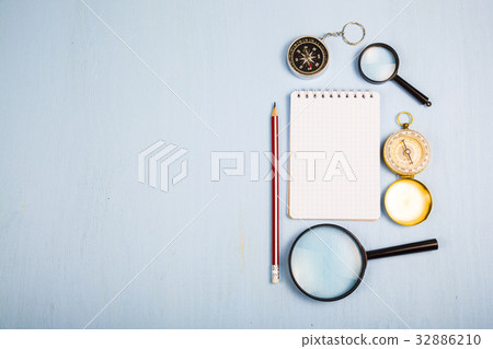 Compass, magnifying glass and notebook Compass, magnifying glass and notebook 32886210