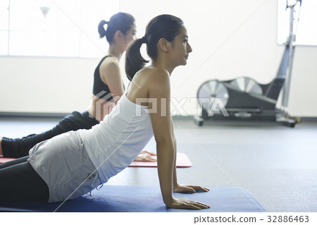 A photo of two young women at a fitness club 32886463