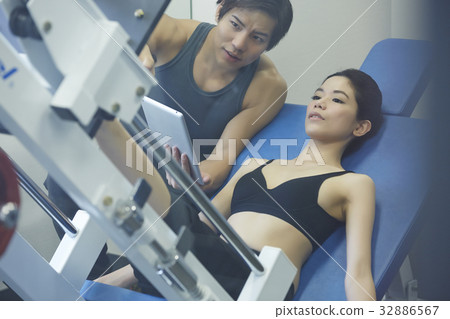 Instructor is teaching his student in training healthy body 32886567