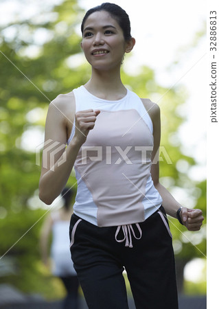 a photo of a woman doing exercise and looking at something. a photo of a woman doing exercise and looking at something. 32886813