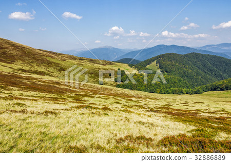 grassy hillsides on mountain ridge grassy hillsides on mountain ridge 32886889