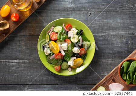 fresh greek salad in plate and ingredients fresh greek salad in plate and ingredients 32887445