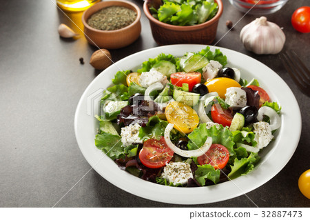 fresh greek salad in plate 32887473