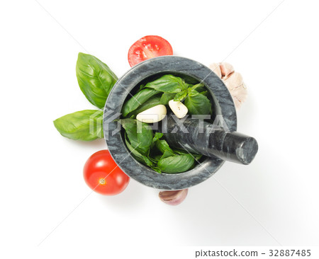 basil in mortar on white background 32887485