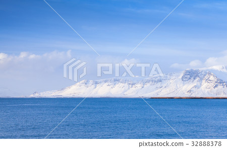 Icelandic coastal landscape with snowy mountains Icelandic coastal landscape with snowy mountains 32888378