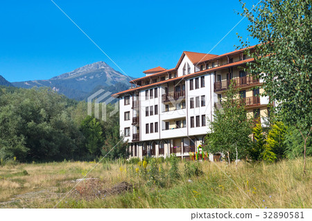Wooden chalet hotel houses and summer mountains 32890581