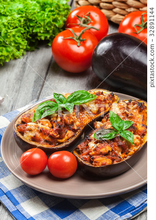 Baked eggplant with pieces of chicken 32891144