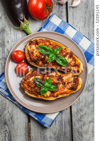 Baked eggplant with pieces of chicken Baked eggplant with pieces of chicken 32891145